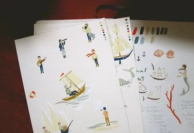 Sketches of sailors, boats and mermaids with paint swatches
