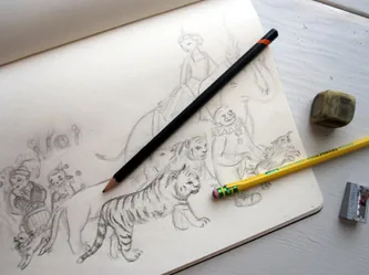 Pencil drawing of animals in progress, with pencils and an eraser
