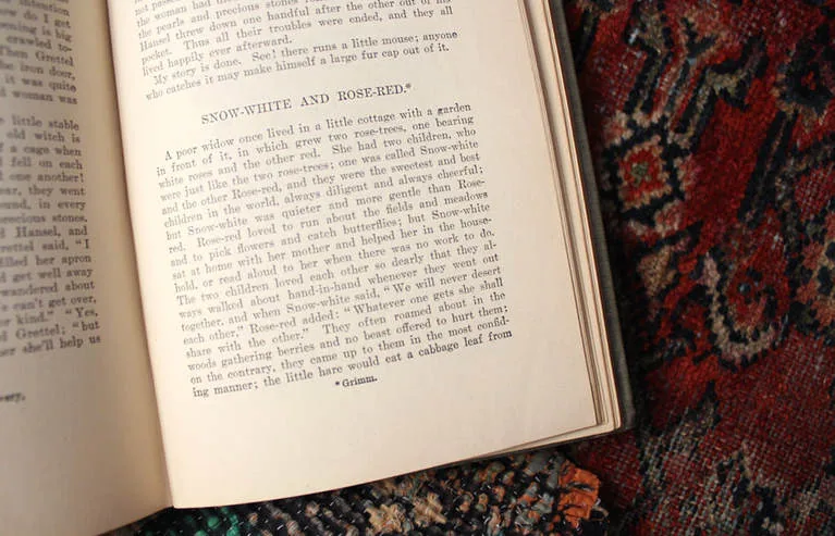 An old book open to the story of Snow-White and Rose-Red